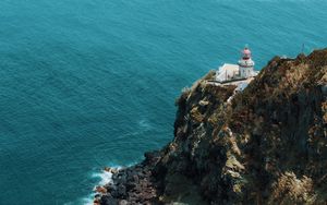 Preview wallpaper sea, rock, building, architecture, cliff