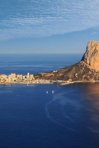 Preview wallpaper sea, rock, buildings, boats, sails