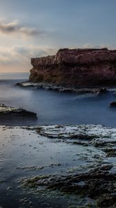 Preview wallpaper sea, rock, coast, relief, long exposure, landscape