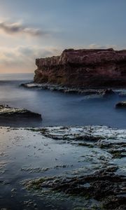 Preview wallpaper sea, rock, coast, relief, long exposure, landscape