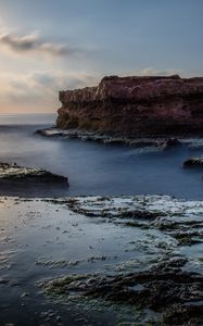 Preview wallpaper sea, rock, coast, relief, long exposure, landscape