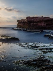 Preview wallpaper sea, rock, coast, relief, long exposure, landscape