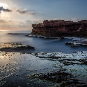 Preview wallpaper sea, rock, coast, relief, long exposure, landscape