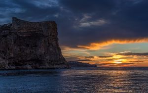 Preview wallpaper sea, rock, sky, sunset