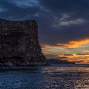 Preview wallpaper sea, rock, sky, sunset