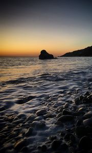 Preview wallpaper sea, rock, stones, pebbles, landscape