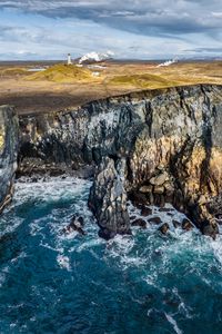 Preview wallpaper sea, rock, stones, lighthouse, nature