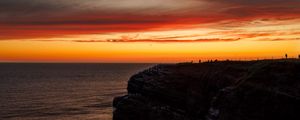 Preview wallpaper sea, rock, sunset, sky, dark, nature