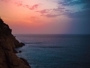 Preview wallpaper sea, rock, twilight, water, shore, horizon