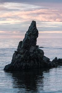 Preview wallpaper sea, rock, water, dusk, landscape