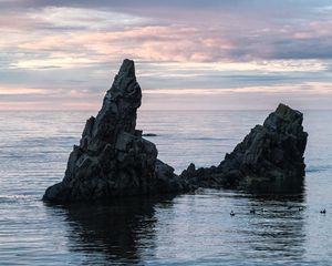 Preview wallpaper sea, rock, water, dusk, landscape