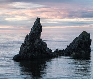 Preview wallpaper sea, rock, water, dusk, landscape