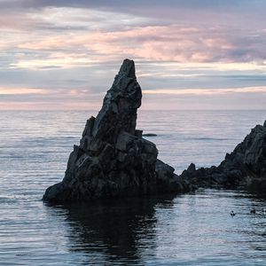 Preview wallpaper sea, rock, water, dusk, landscape