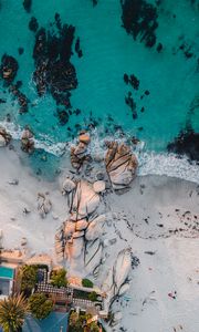 Preview wallpaper sea, rocks, beach, buildings, palm trees, aerial view