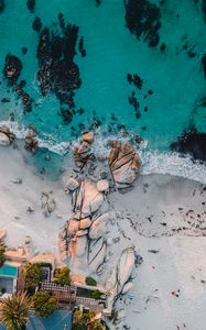 Preview wallpaper sea, rocks, beach, buildings, palm trees, aerial view