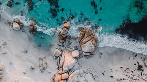 Preview wallpaper sea, rocks, beach, buildings, palm trees, aerial view