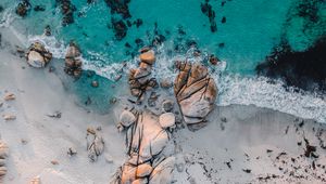 Preview wallpaper sea, rocks, beach, buildings, palm trees, aerial view