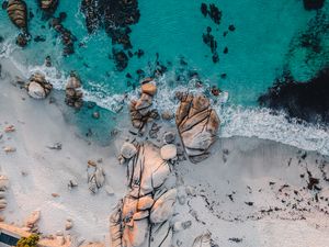 Preview wallpaper sea, rocks, beach, buildings, palm trees, aerial view