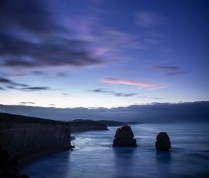 Preview wallpaper sea, rocks, cliff, twilight, landscape