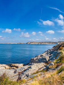 Preview wallpaper sea, rocks, coast, landscape, water, horizon, clouds, nature