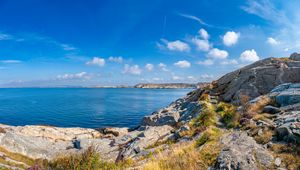 Preview wallpaper sea, rocks, coast, landscape, water, horizon, clouds, nature
