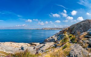 Preview wallpaper sea, rocks, coast, landscape, water, horizon, clouds, nature