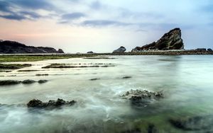 Preview wallpaper sea, rocks, coast, reeves, bank, fog, cloudy, colors