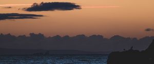 Preview wallpaper sea, rocks, dusk, horizon, clouds