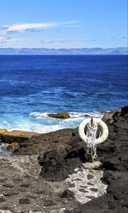 Preview wallpaper sea, rocks, lifebuoy, view