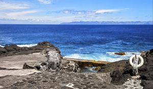 Preview wallpaper sea, rocks, lifebuoy, view