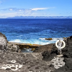 Preview wallpaper sea, rocks, lifebuoy, view