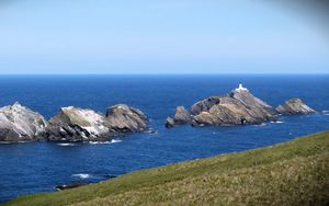 Preview wallpaper sea, rocks, lighthouse, sky, coast, landscape