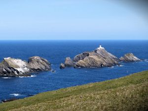 Preview wallpaper sea, rocks, lighthouse, sky, coast, landscape