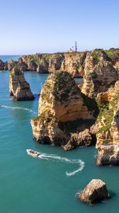 Preview wallpaper sea, rocks, mountains, boat, nature