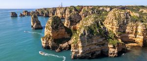 Preview wallpaper sea, rocks, mountains, boat, nature