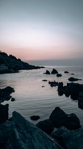 Preview wallpaper sea, rocks, stones, twilight, evening