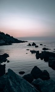 Preview wallpaper sea, rocks, stones, twilight, evening