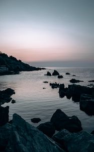 Preview wallpaper sea, rocks, stones, twilight, evening