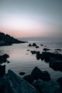 Preview wallpaper sea, rocks, stones, twilight, evening