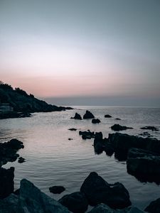 Preview wallpaper sea, rocks, stones, twilight, evening