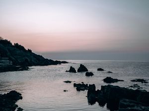 Preview wallpaper sea, rocks, stones, twilight, evening