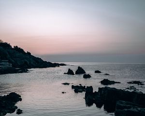 Preview wallpaper sea, rocks, stones, twilight, evening