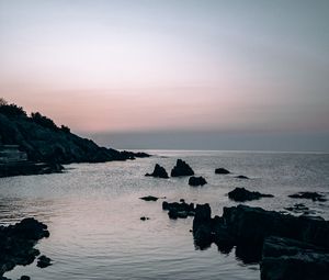 Preview wallpaper sea, rocks, stones, twilight, evening
