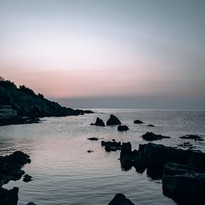 Preview wallpaper sea, rocks, stones, twilight, evening