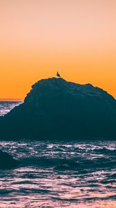 Preview wallpaper sea, rocks, sunset, dusk, waves