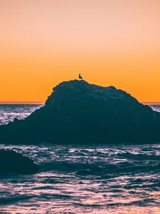 Preview wallpaper sea, rocks, sunset, dusk, waves