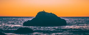 Preview wallpaper sea, rocks, sunset, dusk, waves