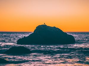 Preview wallpaper sea, rocks, sunset, dusk, waves