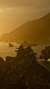 Preview wallpaper sea, rocks, sunset, coast, dusk
