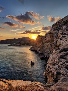 Preview wallpaper sea, rocks, sunset, coast, evening, landscape
